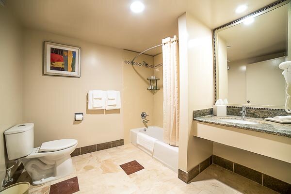 The Executive King Room has a beautifully crafted natural stone bathroom.